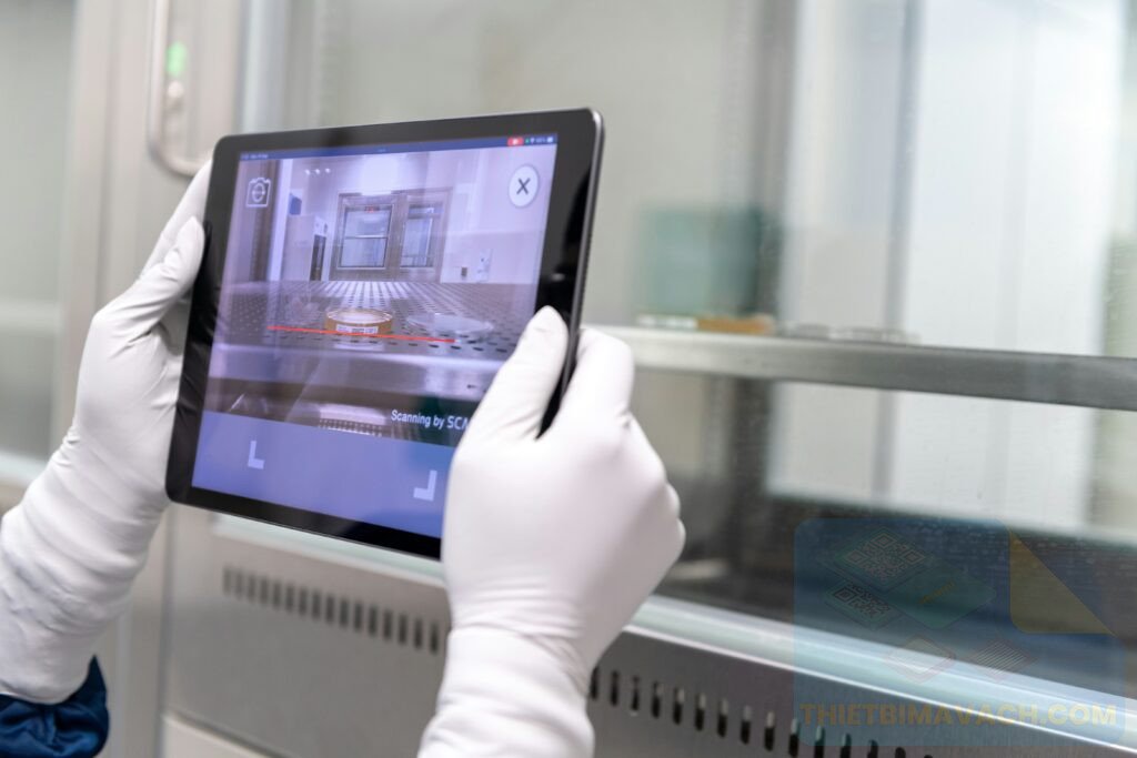 a hand holding a tablet