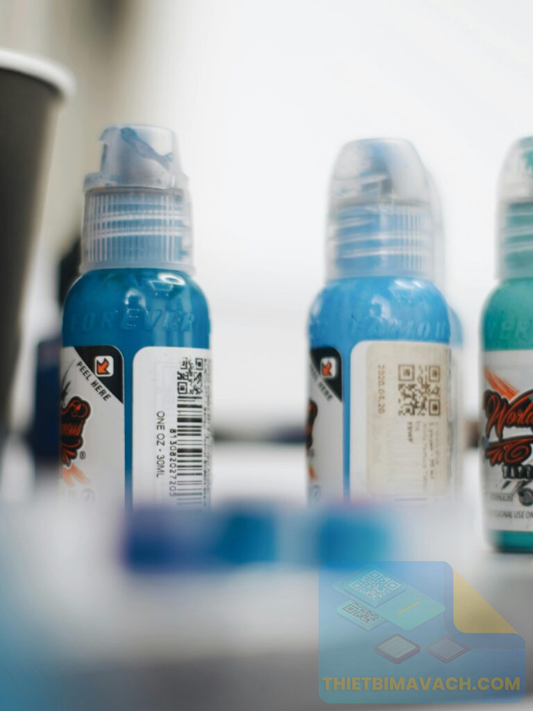 Detailed view of blue bottles with labels, perfect for product displays.