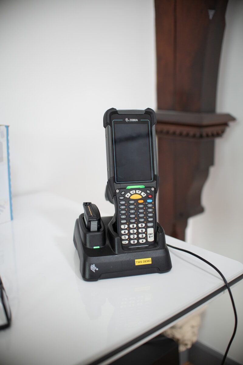 Barcode scanner device in charging dock on table